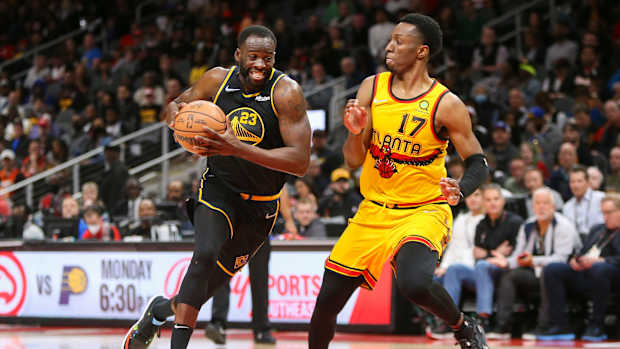 Golden State Warriors forward Draymond Green (23) drives on Atlanta Hawks forward Onyeka Okongwu.